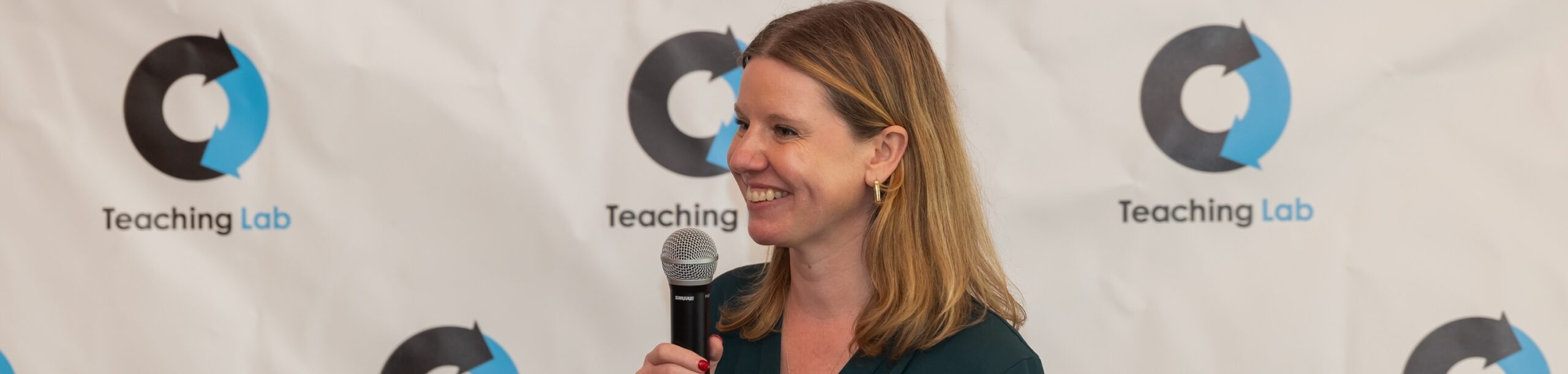 Sarah Johnson speaking into a microphone